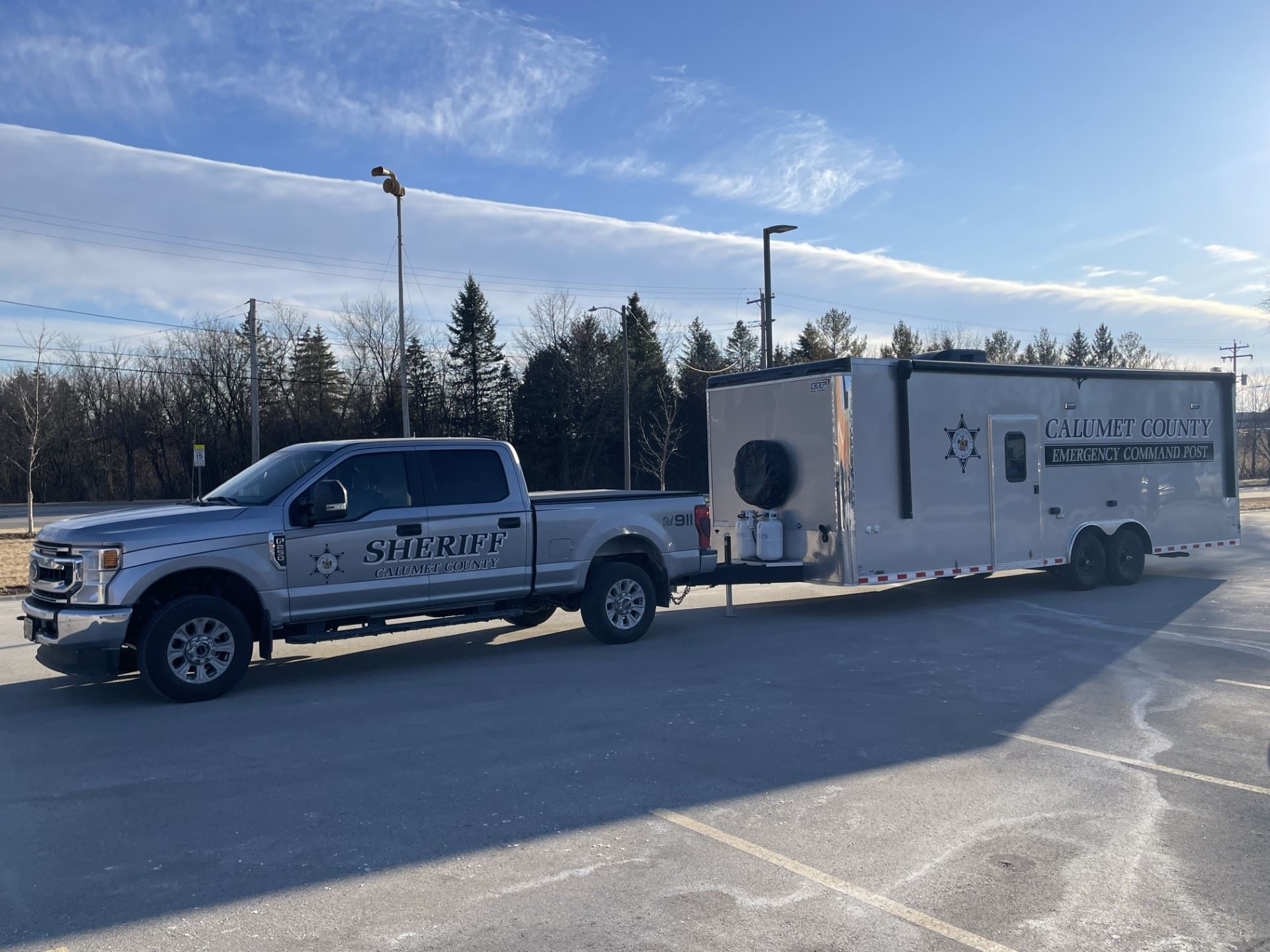 Silver truck and trailer with Calumet County Sheriff and Emergency Command Post lettering