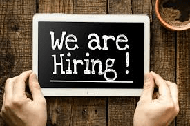 we are hiring written on chalkboard
